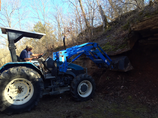 Our neighbor Jerry Killabrew brought is tractor to shave off a few years of hauling laods of clay by hand. 
